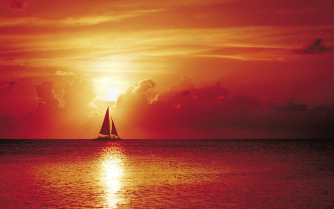 What better way to end the day than sailing into the sunset off Seven Mile Beach . . . Photo By Stephen Clarke